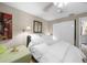 Bedroom with a queen bed and white bedding at 1477 Park Beach Cir # 13, Punta Gorda, FL 33950