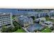 Aerial view of property showcasing a waterfront location, private pool, and neighboring buildings at 1477 Park Beach Cir # 13, Punta Gorda, FL 33950