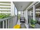 Spacious screened balcony with seating area, ideal for relaxing and enjoying the view at 1477 Park Beach Cir # 13, Punta Gorda, FL 33950
