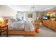 Main bedroom with king-size bed and balcony access at 1477 Park Beach Cir # 13, Punta Gorda, FL 33950
