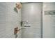 Shower with glass shelves and blue tile at 800 N Tamiami Trl # 1817, Sarasota, FL 34236