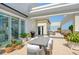 Spacious rooftop patio with dining area and city views at 800 N Tamiami Trl # 1817, Sarasota, FL 34236