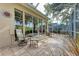 Relaxing screened patio with comfortable seating and golf course view at 8736 52Nd E Dr, Bradenton, FL 34211