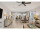 Open kitchen with island, white cabinets, and stainless steel appliances at 5228 Bentgrass Way, Bradenton, FL 34211