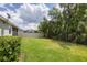 Landscaped backyard with privacy fence at 5228 Bentgrass Way, Bradenton, FL 34211
