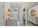 Bright entryway with tile floors, console table and large mirror at 5228 Bentgrass Way, Bradenton, FL 34211