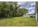 Private backyard with grassy area, fenced-in, and lush landscaping at 5228 Bentgrass Way, Bradenton, FL 34211