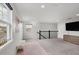 Open loft perfect for a home office or play area with carpet and large windows at 5228 Bentgrass Way, Bradenton, FL 34211