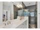 Elegant bathroom with double vanity, large shower, and modern fixtures at 5228 Bentgrass Way, Bradenton, FL 34211