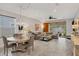 Spacious living area with a wood-look floor, and access to a backyard patio at 5228 Bentgrass Way, Bradenton, FL 34211