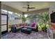 Spacious screened porch with comfortable seating and a view of the backyard at 5228 Bentgrass Way, Bradenton, FL 34211