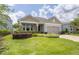 One-story home with gray siding, stone accents and a two-car garage at 5228 Bentgrass Way, Bradenton, FL 34211