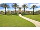 Community clubhouse with palm trees and landscaped grounds at 5228 Bentgrass Way, Bradenton, FL 34211