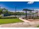 Community tennis courts with seating and shade structures at 4694 Royal Dornoch Cir, Bradenton, FL 34211