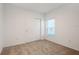 Carpeted bedroom with a double door closet and a window at 5917 Laurelcrest Gln, Palmetto, FL 34221