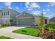 Charming single-Gathering home featuring a two-car garage and well-manicured front lawn at 5917 Laurelcrest Gln, Palmetto, FL 34221