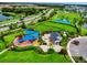 Aerial view of the modern community playground, park, and sidewalks, a lovely area for outdoor fun at 5917 Laurelcrest Gln, Palmetto, FL 34221