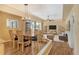 Bright dining room with wood floors and modern light fixture at 2517 Glebe Farm Close # H-2, Sarasota, FL 34235