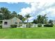 Community pool area with adjacent building at 2517 Glebe Farm Close # H-2, Sarasota, FL 34235