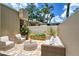 Relaxing patio with wicker furniture and potted plants at 2517 Glebe Farm Close # H-2, Sarasota, FL 34235