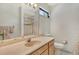 Clean bathroom with a vanity, toilet, and shower at 2517 Glebe Farm Close # H-2, Sarasota, FL 34235