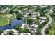 Aerial view highlighting home location near pool and golf course at 2517 Glebe Farm Close # H-2, Sarasota, FL 34235
