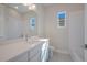 Clean bathroom, featuring white cabinets and a quartz countertop at 12390 Cedar Pass Trl, Parrish, FL 34219