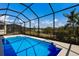 Relaxing screened-in pool with ample surrounding space at 12390 Cedar Pass Trl, Parrish, FL 34219