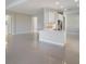 Modern kitchen with white cabinets, stainless steel appliances, and an island at 12390 Cedar Pass Trl, Parrish, FL 34219