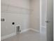 Bright laundry room with built-in shelving and tile floor at 12390 Cedar Pass Trl, Parrish, FL 34219