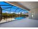 Inviting lanai with pool and screened enclosure; perfect for outdoor relaxation at 12390 Cedar Pass Trl, Parrish, FL 34219