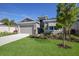 Single-story home with two-car garage and nicely landscaped yard at 12390 Cedar Pass Trl, Parrish, FL 34219