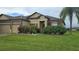 House exterior featuring stone accents and a two-car garage at 7410 64Th E St, Palmetto, FL 34221