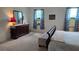 Bedroom with double bed, dresser, and floral curtains at 7410 64Th E St, Palmetto, FL 34221