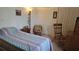 Bedroom with a single bed, chair, and ample closet space at 7410 64Th E St, Palmetto, FL 34221