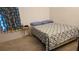 Bedroom with a queen bed and side table at 7410 64Th E St, Palmetto, FL 34221