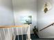 Interior view of a carpeted stairwell with artwork at 4507 9Th W St # E2, Bradenton, FL 34207