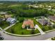 Aerial view of the home with pristine landscaping, mature trees, and neighboring homes in a well-maintained community at 14526 17Th E Ave, Bradenton, FL 34212