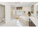 Bright bathroom featuring a soaking tub, separate glass shower, and a vanity with modern fixtures at 14526 17Th E Ave, Bradenton, FL 34212