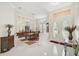 Bright entryway with high ceilings, white tile floors, and elegant double doors at 14526 17Th E Ave, Bradenton, FL 34212