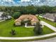 Expansive home with manicured lawn, beautiful landscaping, and a circular driveway at 14526 17Th E Ave, Bradenton, FL 34212