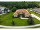 Aerial view of a landscaped home on a cul-de-sac, showcasing the home's curb appeal and manicured lawn at 14526 17Th E Ave, Bradenton, FL 34212