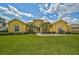 Charming home featuring well-maintained landscaping, a green lawn, and a welcoming entrance at 14526 17Th E Ave, Bradenton, FL 34212