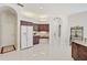 Kitchen with wood cabinets, granite counters, stainless appliances, and tile flooring at 14526 17Th E Ave, Bradenton, FL 34212