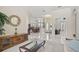 Open-concept living area with white tile floors, a dining area, and a living area at 14526 17Th E Ave, Bradenton, FL 34212