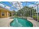 Screened-in pool and spa, surrounded by landscaping, make this a relaxing backyard space at 14526 17Th E Ave, Bradenton, FL 34212