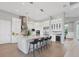 Modern kitchen with white cabinets, large island, and stainless steel appliances at 14728 Derna Ter, Lakewood Ranch, FL 34211