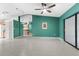 Open living space features tile floors and teal walls at 2903 60Th W St, Bradenton, FL 34209