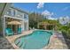 Inviting freeform pool with spa and patio at 13609 3Rd E Ave, Bradenton, FL 34212