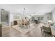 Open concept dining room features a farmhouse table and connects to the living room at 13609 3Rd E Ave, Bradenton, FL 34212